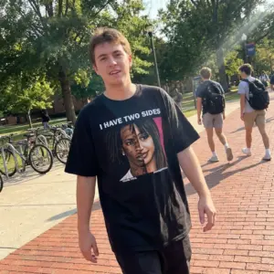 I Have Two Sides Young Thug PinkPantheress Music Meme T-Shirt 10 Everyday streetwear outfit styling black shirt with black tee front print reading I HAVE TWO SIDES above split portraits of Young Thug and PinkPantheress