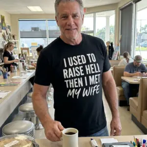 I Used to Raise Hell Then I Met My Wife T-Shirt 11 Another lifestyle perspective highlighting the typography of the "I Used to Raise Hell" shirt design.