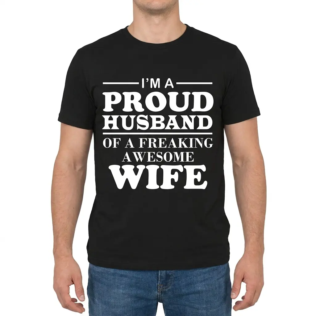 I'm A Proud Husband Of A Freaking Awesome Wife Black T-Shirt 4 Man wearing black graphic tee with black tee front print reading IM A PROUD HUSBAND OF A FREAKING AWESOME WIFE in bold white serif lettering