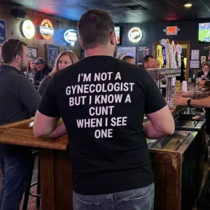 I'm Not A Gynecologist But I Know A Cunt When I See One Tee 10 Everyday streetwear outfit styling black shirt with black tee back print reading IM NOT A GYNECOLOGIST BUT I KNOW A CUNT WHEN I SEE ONE in white block text