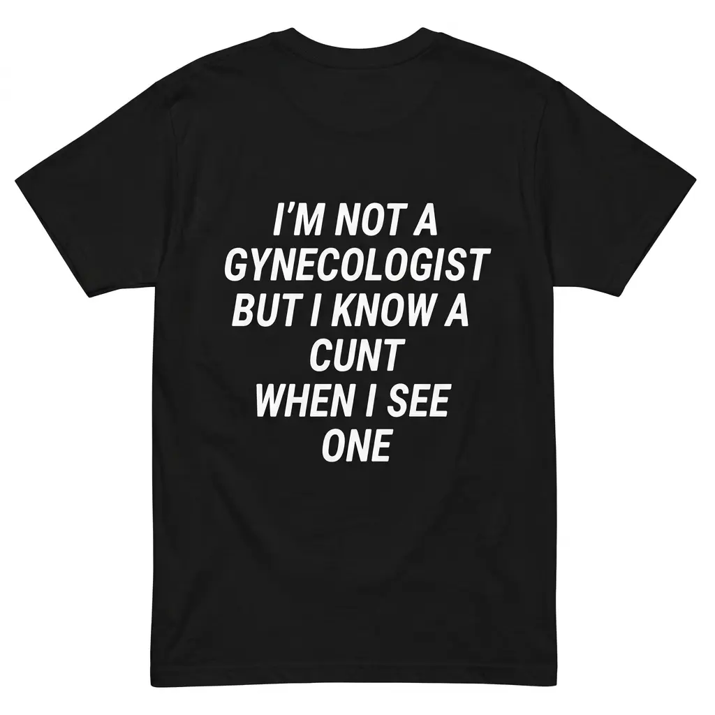 Flatlay black t-shirt featuring black tee back print reading IM NOT A GYNECOLOGIST BUT I KNOW A CUNT WHEN I SEE ONE in white block text