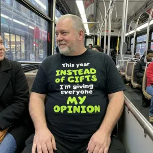 Instead of Gifts, I'm Giving My Opinion T-Shirt 11 Lifestyle view of the opinion-themed shirt with the message “This year INSTEAD of GIFTS I’m giving everyone MY OPINION”