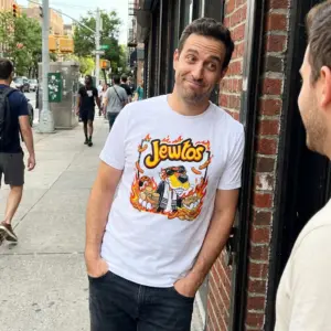 Jewtos Flamin Hot Snack Parody Cheetah Graphic White T-Shirt 10 Everyday streetwear outfit styling white shirt with white tee front print reading JEWTOS above a cartoon cheetah in sunglasses holding gold coins and