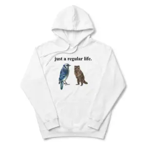 Just A Regular Life Blue Jay And Raccoon Funny White T-Shirt 7 Cozy pullover hoodie displaying white tee front print reading JUST A REGULAR LIFE above a realistic watercolor blue jay and standing brown raccoon
