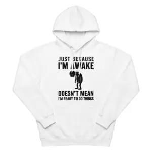Just Because Im Awake Doesnt Mean Im Ready Funny T-Shirt 7 Flat lay view of a hoodie featuring the Just Because I'm Awake tired graphic design.