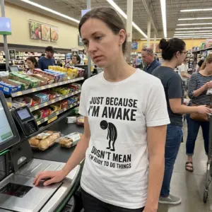 Just Because Im Awake Doesnt Mean Im Ready Funny T-Shirt 10 Lifestyle view showcasing the Just Because I'm Awake graphic shirt.