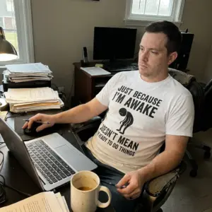 Just Because Im Awake Doesnt Mean Im Ready Funny T-Shirt 11 Casual lifestyle setting featuring the humorous Just Because I'm Awake apparel.