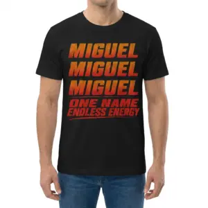 Miguel One Name Endless Energy Distressed Graphic Black T-Shirt 9 Man wearing black graphic tee with black tee front print reading MIGUEL three times in distressed orange red gradient above ONE NAME ENDLESS ENERGY