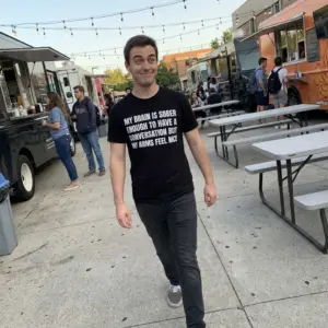 My Brain Is Sober Enough But My Arms Feel Nice T-Shirt 10 Everyday streetwear outfit styling black shirt with black tee front print reading MY BRAIN IS SOBER ENOUGH TO HAVE A CONVERSATION BUT MY ARMS FEEL NICE in