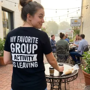 My Favorite Group Activity Is Leaving T-Shirt 11 Casual lifestyle scene featuring the back print of the black funny introvert graphic t-shirt.