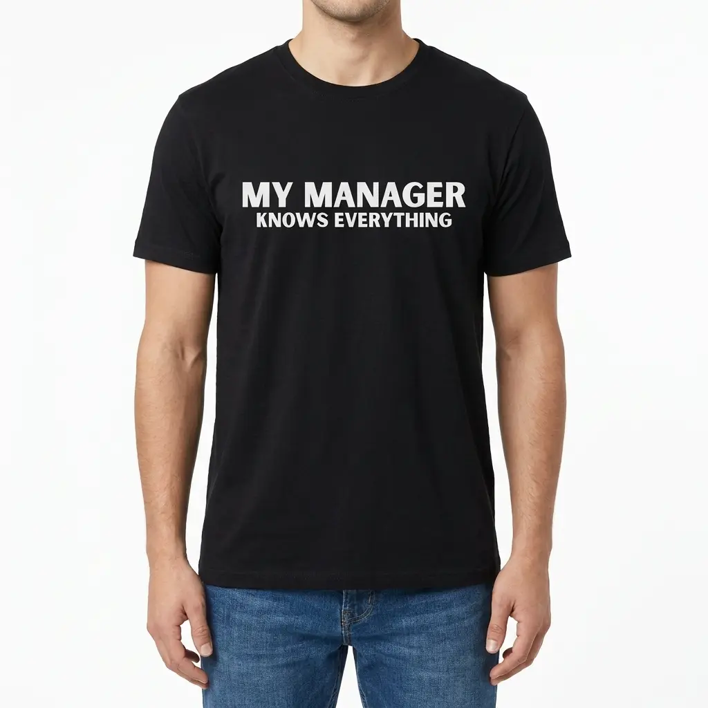 Man wearing black graphic tee with black tee front print reading MY MANAGER KNOWS EVERYTHING in clean bold white block letters