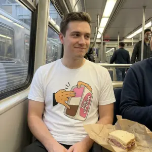 Neapolitan Ice Cream Shocker Hand Innuendo Funny T-Shirt 10 Everyday streetwear outfit styling white shirt with white tee front print showing a cartoon hand dipping fingers into a Neapolitan ice cream tub