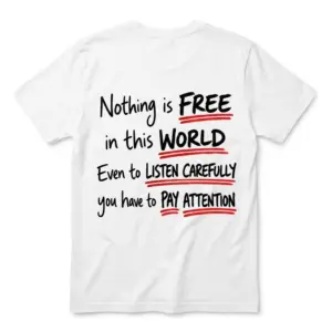 Flat lay back view of a white t-shirt featuring the funny quote Nothing Is Free In This World You Have To Pay Attention with red underlines.