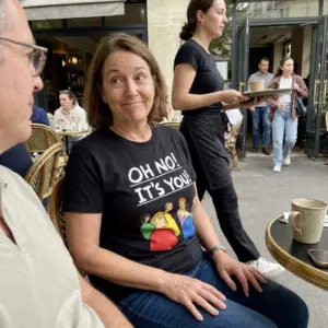 Oh No It's You Awkward Crowd Glare Cartoon T-Shirt 11 Close-up casual look showcasing black tee and black tee front print reading OH NO ITS YOU above six cartoon characters glaring over their shoulders