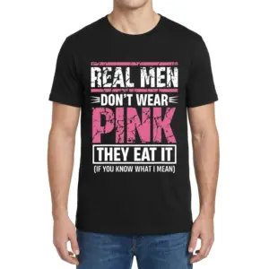Real Men Don't Wear Pink They Eat It Funny T-Shirt 9 Male model facing forward wearing the real men dont wear pink shirt, highlighting the funny distressed text design on the front.