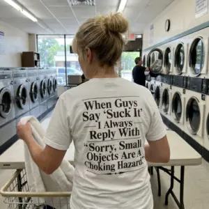 Sorry Small Objects Are A Choking Hazard Savage Comeback Tee 11 Everyday outdoor look showcasing the back print of the white Small Objects Are A Choking Hazard joke t-shirt