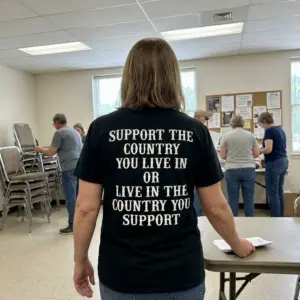 Support The Country You Live In Patriotic Slogan T-Shirt 11 Everyday street photo showing the back print of the black Support The Country You Live In statement shirt