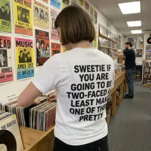 Sweetie If Youre Two Faced Make One Pretty Sarcastic T-Shirt 10 Lifestyle setting displaying the sarcastic shirt with Sweetie If You Are Going To Be Two-Faced text on the back.