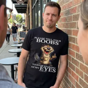 Tell Your Boobs Stop Staring Coffee Otter Funny T-Shirt 10 Lifestyle view showcasing the funny coffee otter boobs staring shirt worn in a casual everyday setting.