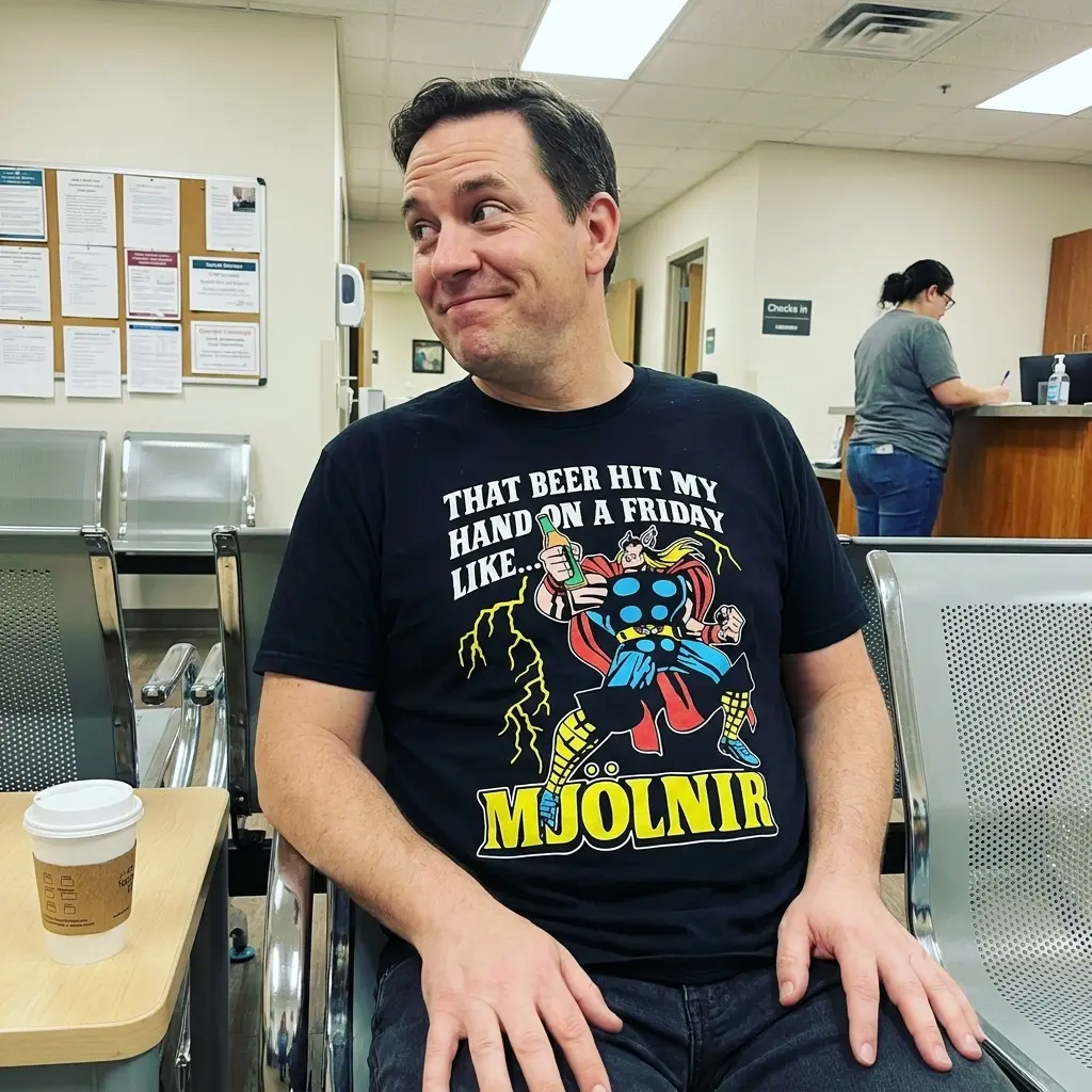 That Beer Hit My Hand On A Friday Like Mjolnir Funny T-Shirt 5 Everyday streetwear outfit styling black shirt with black tee front print reading THAT BEER HIT MY HAND ON A FRIDAY LIKE MJOLNIR with a comic thunder