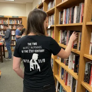 The Two Worst Mornings Of The 21st Century 9/11 11/9 T-Shirt 11 Everyday street look showing the back print of the black 9/11 & 11/9 political satire graphic t-shirt