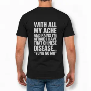With All My Ache And Pains Yung No Mo Funny Getting Older T-Shirt 9 Man wearing black graphic tee with black tee back print reading WITH ALL MY ACHE AND PAINS YUNG NO MO in distressed white block letters