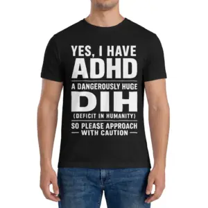 Yes I Have ADHD A Dangerously Huge Dih Funny Acronym T-Shirt 9 Man wearing black graphic tee with black tee front print reading YES I HAVE ADHD A DANGEROUSLY HUGE DIH DEFICIT IN HUMANITY in white text