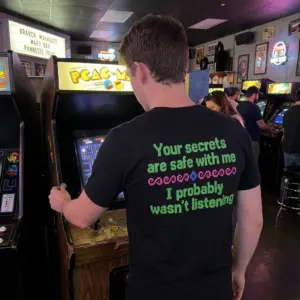 Your Secrets Are Safe With Me I Wasn't Listening T-Shirt 10 Everyday streetwear outfit styling black shirt with black tee back print in green 8-bit pixel text reading Your secrets are safe with me I probably wasnt