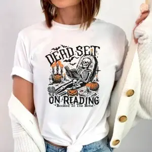 Funny Halloween Skeleton Reading T Shirt – Booked to the Bone 1