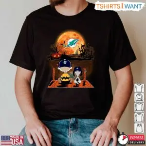 Miami Dolphins Snoopy Halloween T-Shirt – Charlie Brown and Snoopy Watching Dolphins Football Tee 10 Miami Dolphins Snoopy Halloween T Shirt Charlie Brown and Snoopy Watching Dolphins Football Tee 2 1 1.jpg
