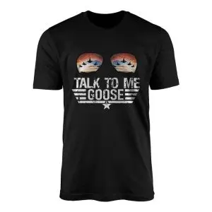 Black flat-lay t-shirt featuring aviator sunglasses reflecting fighter jets at sunset above distressed white Talk To Me Goose text.